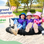 Children enjoying playground activities that encourage physical development