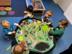 Children participating in sensory play activities at Jacaranda Childcare Centre with hands-on learning experiences
